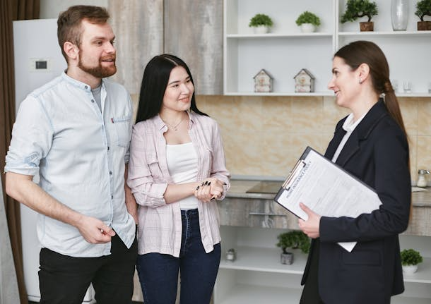 A property manager reviewing a rental application at a desk.