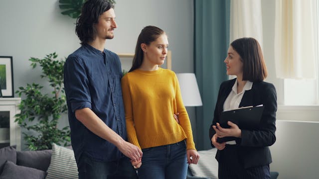 tenants speaking with a property manager in their rental