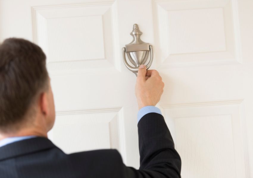 property manager knocking on a tenant's door