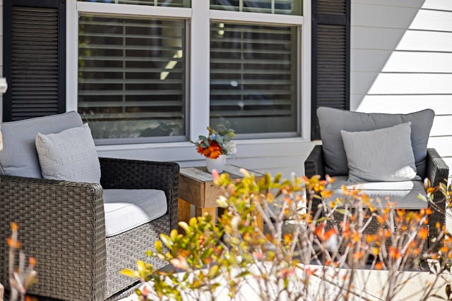 two outdoor armchairs on a patio