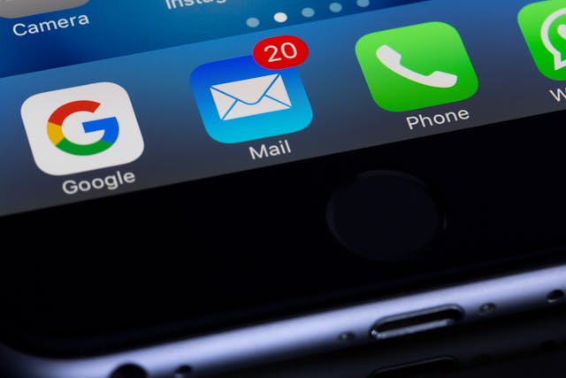 an email app on a phone with a notification