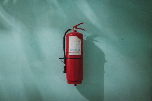 a  fire extinguisher against a blue background