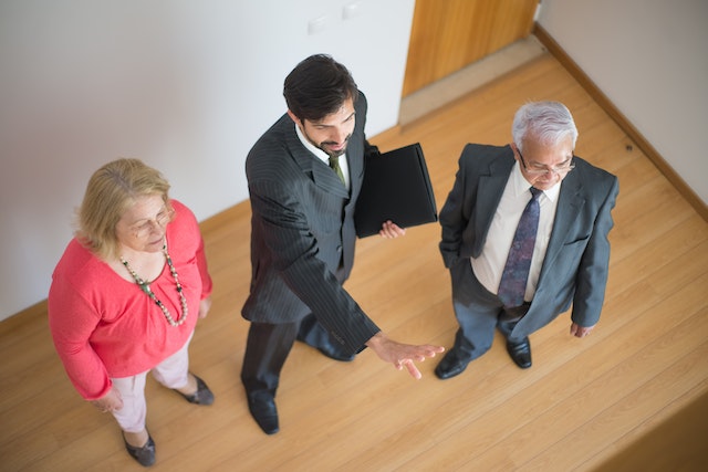 a property managers conducting a property showing for two tenants