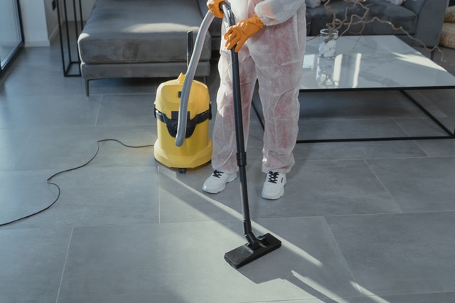 a professional cleaner cleaning flooring
